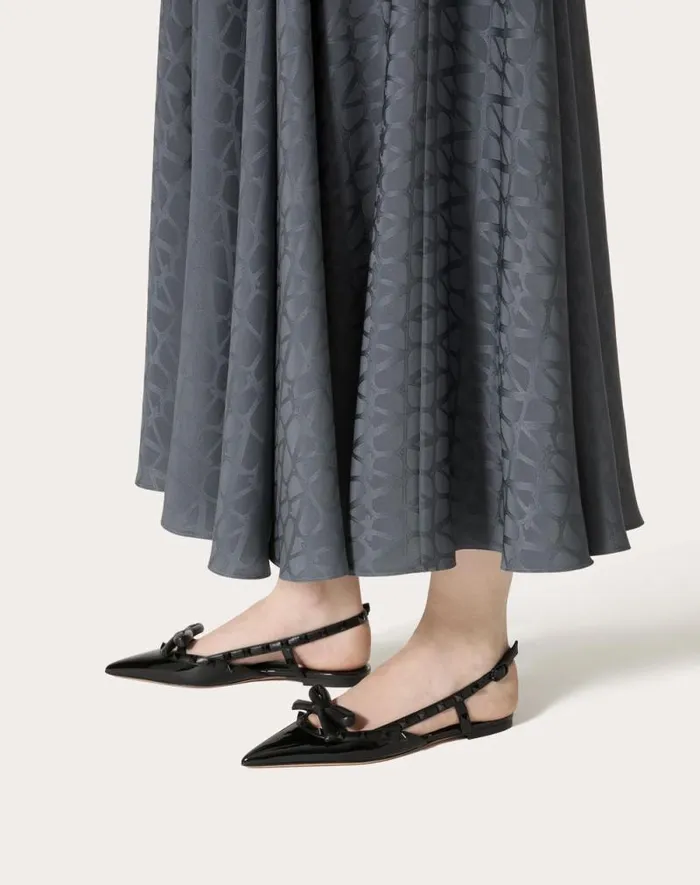 Valentino Ballerinas Woman Rockstud Bow Slingback Ballerina In Patent Leather With Toneontone Studs For Woman In Black Black