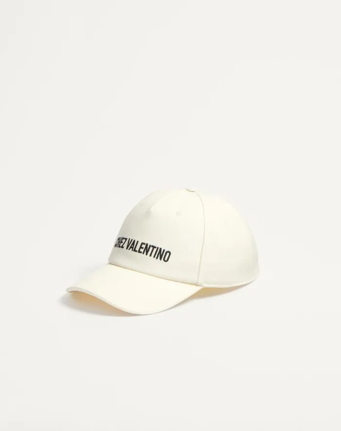 Valentino Hats And Gloves Woman Chez Valentino Cotton Baseball Cap For Woman In Blackivory Blackivory Valentino Hats And Gloves Woman Chez Valentino Cotton Baseball Cap For Woman In Blackivory Blackivory