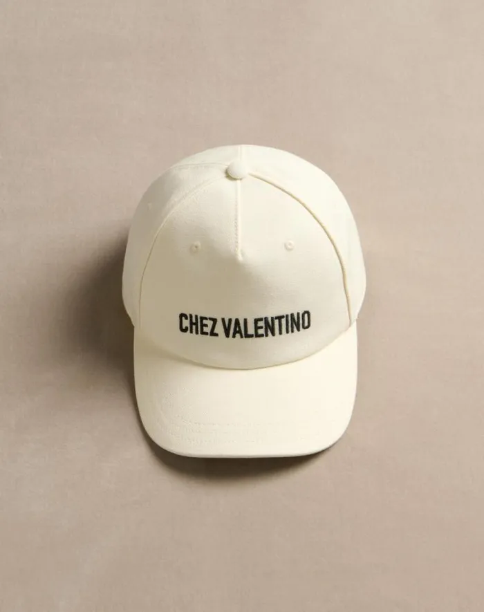 Valentino Hats And Gloves Woman Chez Valentino Cotton Baseball Cap For Woman In Blackivory Blackivory Valentino Hats And Gloves Woman Chez Valentino Cotton Baseball Cap For Woman In Blackivory Blackivory