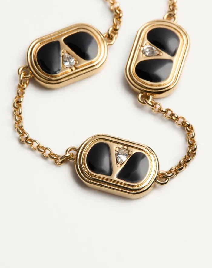 Valentino Jewelry Woman Oval Bracelet In Metal Enamel Crystals And Swarovski Pearl For Woman In Goldblackcrystalcream Goldblackcrystalcream Valentino Jewelry Woman Oval Bracelet In Metal Enamel Crystals And Swarovski Pearl For Woman In Goldblackcrystalcream Goldblackcrystalcream