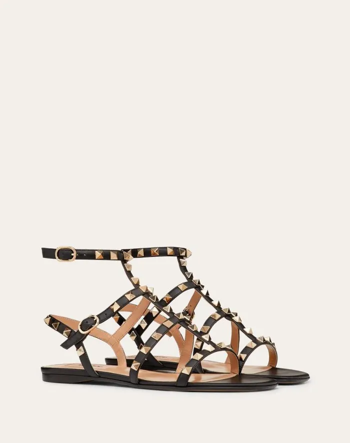 Valentino Sandals Woman Rockstud Flat Calfskin Sandal With Straps For Woman In Black Black Valentino Sandals Woman Rockstud Flat Calfskin Sandal With Straps For Woman In Black Black