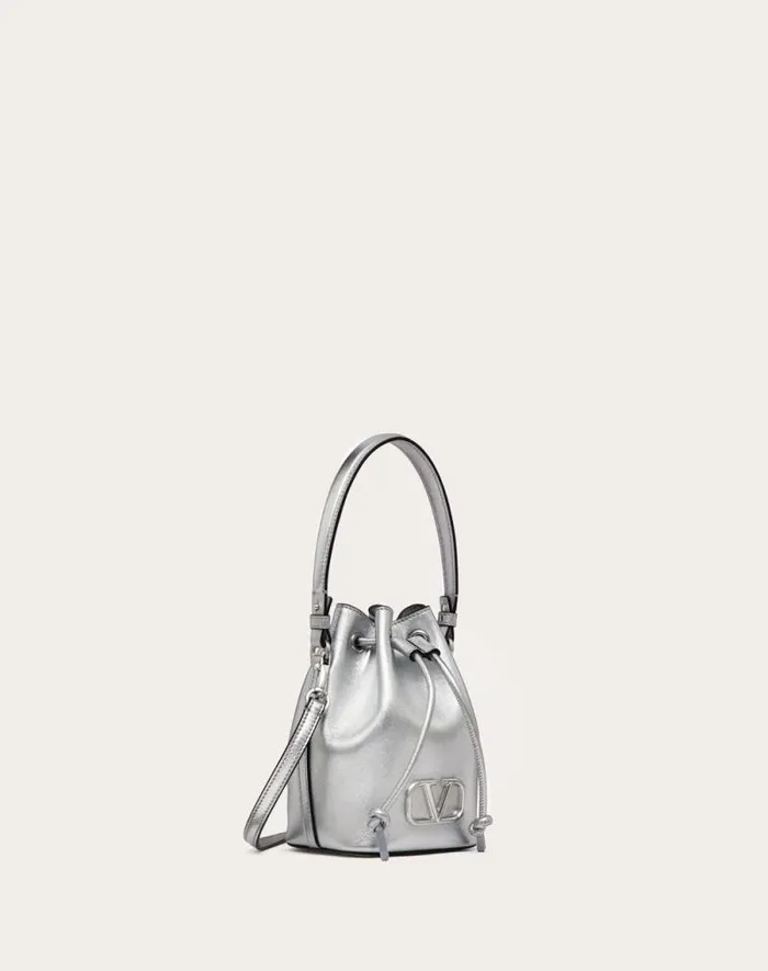 Valentino Shoulder Bags Woman Mini Vlogo Signature Bucket Bag In Metallic Nappa Leather For Woman In Silver Silver Valentino Shoulder Bags Woman Mini Vlogo Signature Bucket Bag In Metallic Nappa Leather For Woman In Silver Silver