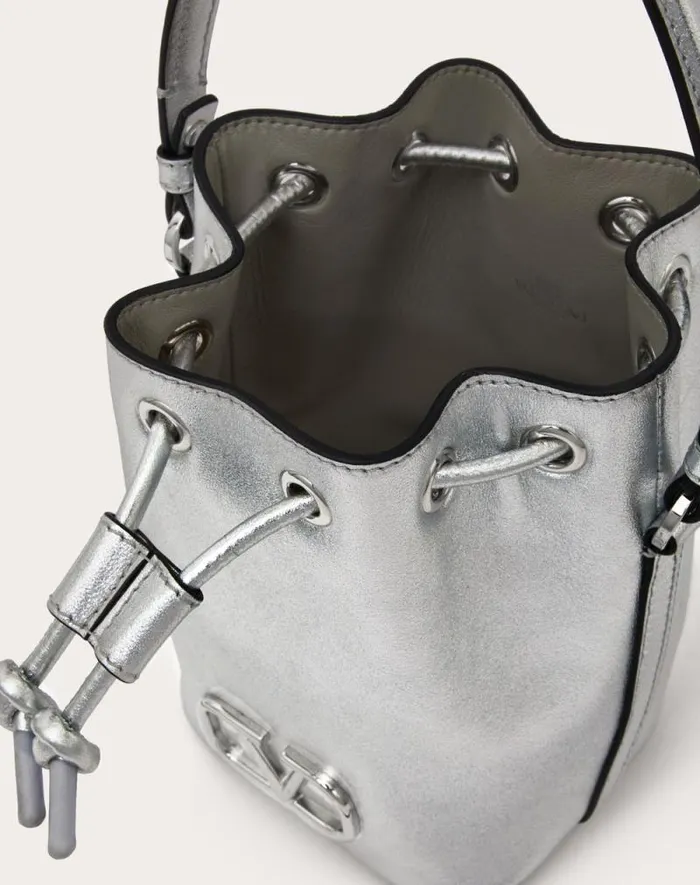 Valentino Shoulder Bags Woman Mini Vlogo Signature Bucket Bag In Metallic Nappa Leather For Woman In Silver Silver Valentino Shoulder Bags Woman Mini Vlogo Signature Bucket Bag In Metallic Nappa Leather For Woman In Silver Silver