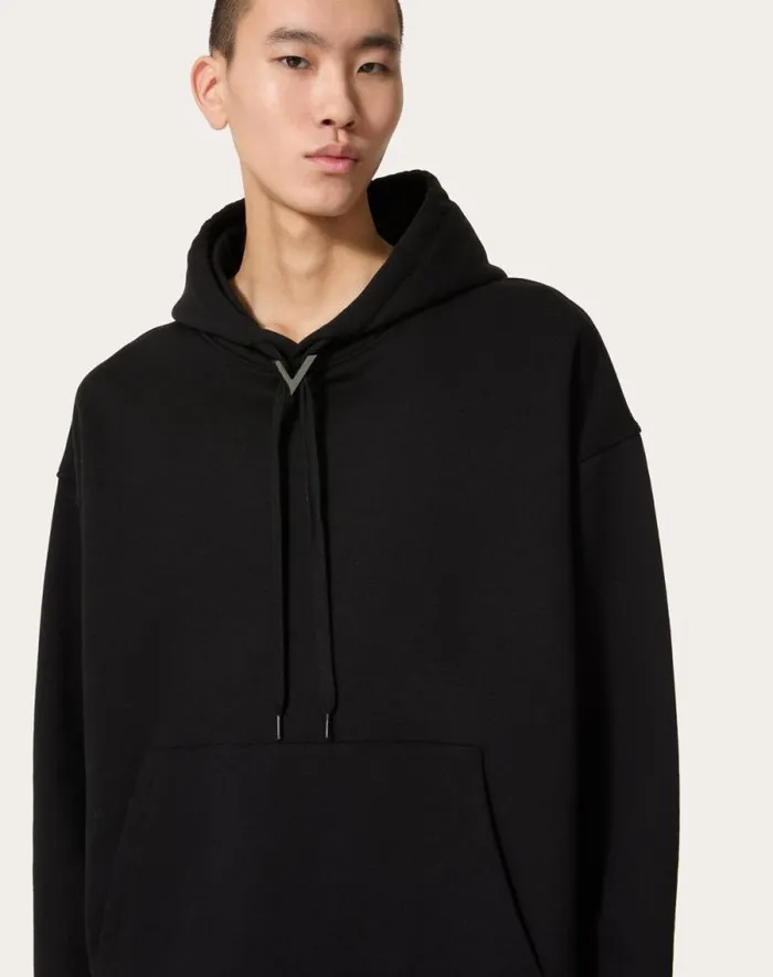 Valentino Tshirts And Sweatshirts Man Cotton Hooded Sweatshirt With Metallic V Detail For Man In Black Black Valentino Tshirts And Sweatshirts Man Cotton Hooded Sweatshirt With Metallic V Detail For Man In Black Black