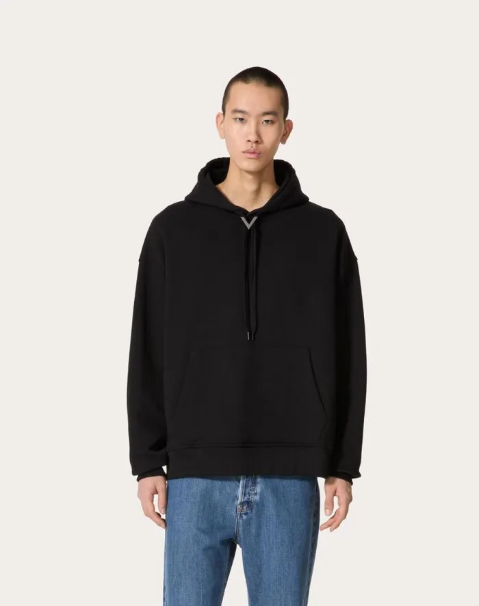 Valentino Tshirts And Sweatshirts Man Cotton Hooded Sweatshirt With Metallic V Detail For Man In Black Black Valentino Tshirts And Sweatshirts Man Cotton Hooded Sweatshirt With Metallic V Detail For Man In Black Black